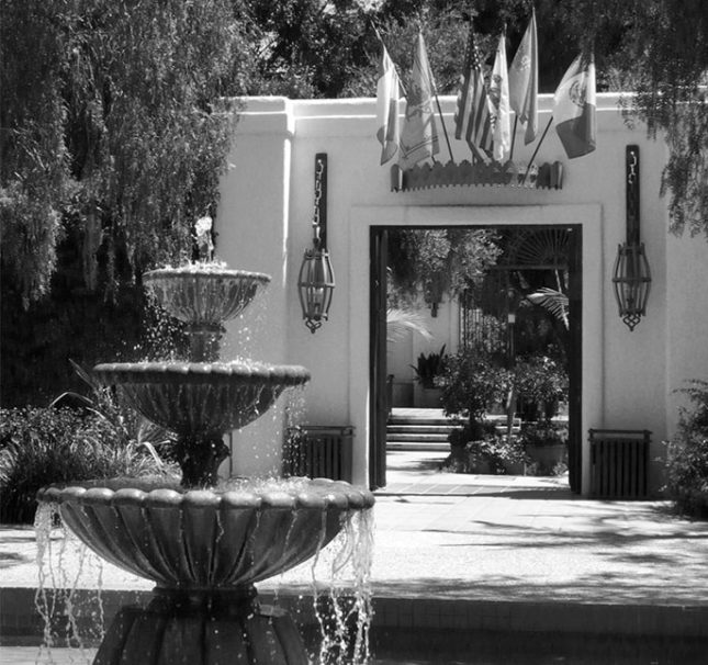 Black-and-white photo of a multi-tiered fountain at the entrance to Lawry's California Center