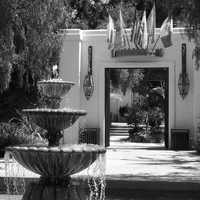 Black-and-white photo of a multi-tiered fountain at the entrance to Lawry's California Center