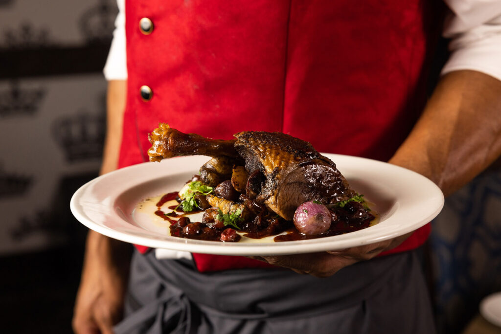 five crowns server with an amazing looking holiday dish