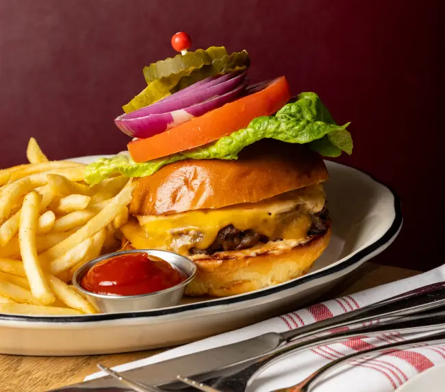 The Tam Burger with melted cheddar and fries served in The Pub at Tam O'Shanter