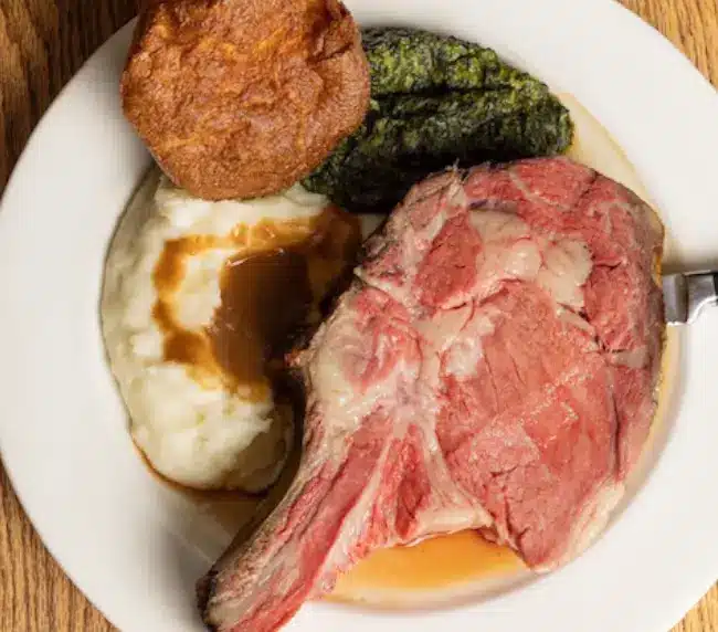 In-house smoked Certified Angus Beef prime rib served with Idaho mashed potatoes and Yorkshire pudding at Tam O'Shanter