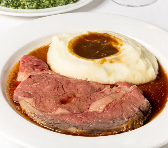 Akaushi Beef Prime Rib served with mashed potatoes at Lawry's Beverly Hills